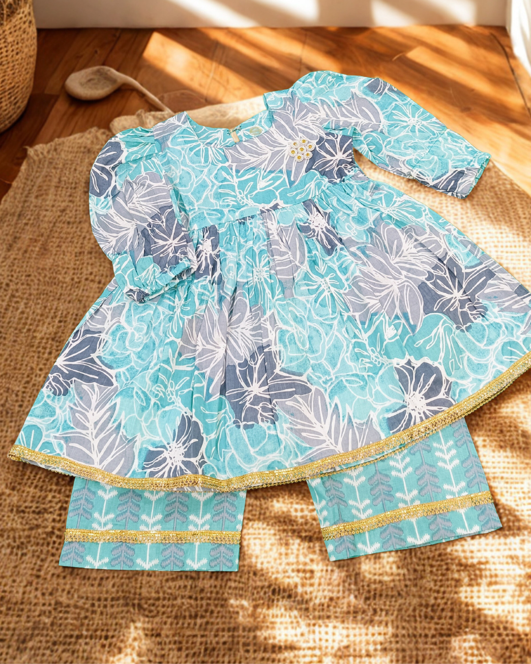 Baby girl aqua blue cambric cotton printed kurti pajama set flat lay daily wear